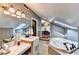 Bright bathroom featuring marble counters, a soaking tub, and elegant fixtures at 2962 Norman Cir, Duluth, GA 30096