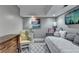 Inviting bedroom with a comfortable daybed, artwork, and a charming seating area for relaxation at 2962 Norman Cir, Duluth, GA 30096