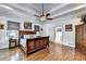 Spacious bedroom featuring hardwood floors, a ceiling fan, and ample natural light, creating a relaxing atmosphere at 2962 Norman Cir, Duluth, GA 30096