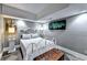 Charming bedroom featuring a decorative bed frame, stylish lighting, and elegant wall art at 2962 Norman Cir, Duluth, GA 30096