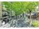 Outdoor deck with furniture, grill, and a view of the lush, green backyard at 2962 Norman Cir, Duluth, GA 30096