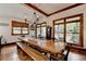 Inviting dining area with hardwood floors, lots of windows, a long table, and an open view to the outdoors at 2962 Norman Cir, Duluth, GA 30096