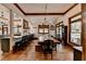 Bright dining room with a long wooden table and wood floors at 2962 Norman Cir, Duluth, GA 30096