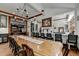 Bright dining room with a long wooden table and view into living room at 2962 Norman Cir, Duluth, GA 30096