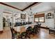 Bright dining room with a long wooden table and view into kitchen at 2962 Norman Cir, Duluth, GA 30096