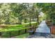 Picturesque driveway leading to a charming home, surrounded by a beautifully manicured lawn and mature trees at 2962 Norman Cir, Duluth, GA 30096