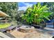Cozy stone fire pit surrounded by benches and lush landscaping for outdoor enjoyment at 2962 Norman Cir, Duluth, GA 30096