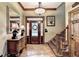 Foyer with hardwood floors, staircase, decorative mirror, and natural lighting at 2962 Norman Cir, Duluth, GA 30096