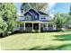 Charming two-story home featuring a welcoming front porch and well-manicured lawn at 2962 Norman Cir, Duluth, GA 30096