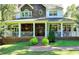 A welcoming covered front porch with a fan and seating area at 2962 Norman Cir, Duluth, GA 30096