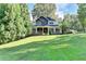 Charming two-story home with a welcoming front porch, manicured lawn, and mature trees at 2962 Norman Cir, Duluth, GA 30096