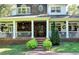 A welcoming covered front porch with a fan and seating area at 2962 Norman Cir, Duluth, GA 30096