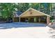 A large detached garage and car port feature plenty of space and parking at 2962 Norman Cir, Duluth, GA 30096