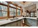 Bright kitchen with granite countertops, stainless sink, and a garden view from the large window at 2962 Norman Cir, Duluth, GA 30096
