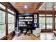 Charming library bathed in natural light with built-in bookshelves and hardwood floors at 2962 Norman Cir, Duluth, GA 30096
