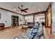 Open-concept living room with hardwood floors and custom bookcase views the kitchen at 2962 Norman Cir, Duluth, GA 30096
