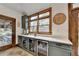 Mudroom with built-in cabinets, granite countertop and access to an outdoor living area at 2962 Norman Cir, Duluth, GA 30096