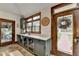 Mudroom with built-in cabinets, granite countertop and access to the outside and living area at 2962 Norman Cir, Duluth, GA 30096