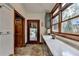 Mudroom with built-in cabinets, granite countertop and access to an outdoor living area at 2962 Norman Cir, Duluth, GA 30096