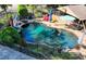 Aerial view of in-ground pool with a slide and surrounding patio with lounge chairs at 2962 Norman Cir, Duluth, GA 30096