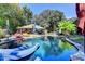 Relaxing backyard pool with lounge seating, surrounded by lush greenery and shade at 2962 Norman Cir, Duluth, GA 30096