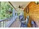 Inviting covered porch with rocking chairs, wood ceiling, and decorative wreath detail at 2962 Norman Cir, Duluth, GA 30096