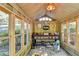 Sunroom with vintage workbench, potting table, and windows all around for plants at 2962 Norman Cir, Duluth, GA 30096