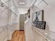 Walk-in closet with custom shelving for clothes and shoes at 2962 Norman Cir, Duluth, GA 30096
