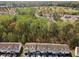 Aerial view of a neighborhood with houses, green trees, and a forest in the distance at 4457 Watson Ridge Dr, Stone Mountain, GA 30083