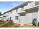 Backyard with lush green grass, partial fence, and two-story condo building at 4457 Watson Ridge Dr, Stone Mountain, GA 30083