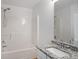 Bathroom with granite countertop vanity and a shower-tub combination at 4457 Watson Ridge Dr, Stone Mountain, GA 30083