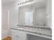 Bathroom with large mirror, granite countertop, and combo shower-tub at 4457 Watson Ridge Dr, Stone Mountain, GA 30083