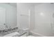 A clean bathroom with a granite countertop and a tub shower at 4457 Watson Ridge Dr, Stone Mountain, GA 30083