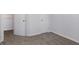 Neutral bedroom with soft gray carpet and white painted walls, baseboards, and trim at 4457 Watson Ridge Dr, Stone Mountain, GA 30083