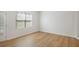 Bright, empty bedroom with hardwood floors and ample natural light at 4457 Watson Ridge Dr, Stone Mountain, GA 30083