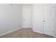 A light and airy bedroom with neutral colored walls and carpet plus access to two closets at 4457 Watson Ridge Dr, Stone Mountain, GA 30083