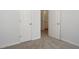 Bedroom with carpet and neutral colored walls plus access to a bathroom and closet at 4457 Watson Ridge Dr, Stone Mountain, GA 30083