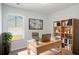 Bright home office with built-in shelves, desk, and a large window for natural light at 4457 Watson Ridge Dr, Stone Mountain, GA 30083