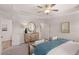 Spacious bedroom with tray ceilings, ceiling fan, carpet floors, and a modern dresser at 6324 Rosetta Drive, Lot 2, South Fulton, GA 30331