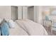 Cozy bedroom featuring closet access, bedside table and a comfortable upholstered chair at 6324 Rosetta Drive, Lot 2, South Fulton, GA 30331