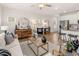 Open-concept living room with modern decor, stainless steel appliances, and an eat-in kitchen at 6324 Rosetta Drive, Lot 2, South Fulton, GA 30331