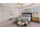 The primary bedroom offers natural light, carpeted floors, and a decorative tray ceiling with ceiling fan at 6324 Rosetta Drive, Lot 2, South Fulton, GA 30331