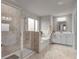 Bathroom featuring a glass-enclosed shower, soaking tub and white vanity with a mirror at 1105 Alaska St, Hampton, GA 30228