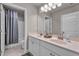 Bright bathroom featuring a double vanity, large mirror and a shower/tub combination at 1105 Alaska St, Hampton, GA 30228