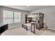 Stylish bedroom featuring a bunk bed with built-in storage and a cozy teddy bear at 1105 Alaska St, Hampton, GA 30228