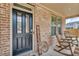 Inviting front porch with rocking chairs and a 'Welcome' sign, showcasing the home's entrance at 1105 Alaska St, Hampton, GA 30228