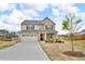 Beautiful two-story home with a long drive, well-manicured lawn and beautiful landscaping at 1105 Alaska St, Hampton, GA 30228