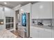 Modern kitchen with stainless steel refrigerator, double ovens, quartz countertops, and subway tile backsplash at 1105 Alaska St, Hampton, GA 30228