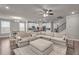 Inviting living room with an open floor plan, flowing into the kitchen and dining area at 1105 Alaska St, Hampton, GA 30228