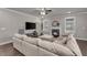 Comfortable living room featuring a fireplace, large TV, and stylish decor at 1105 Alaska St, Hampton, GA 30228